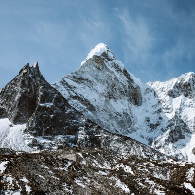Island Peak rising above snowy Himalayan ridges as seen from Chhukung Ri in Nepal.