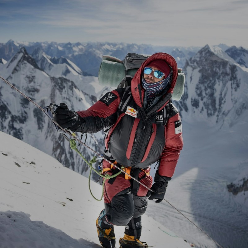 Nirmal Purja (Nimsdai) ascending K2 during the historic first winter summit expedition in 2021, wearing high-altitude climbing gear on the Abruzzi Spur.